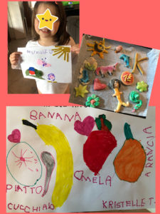 Bambina con vari disegni e creazioni fatte con la pasta modellabile